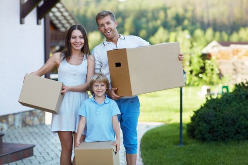 Moving team handling flat removals in Kingstonvale outside an apartment building